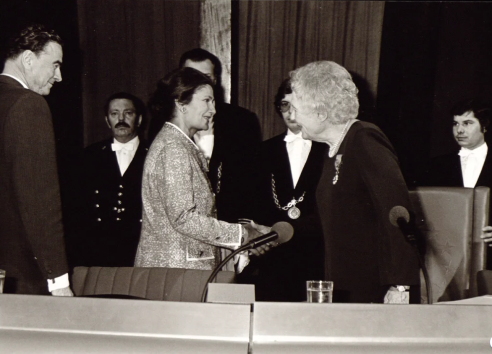 two women shaking hands